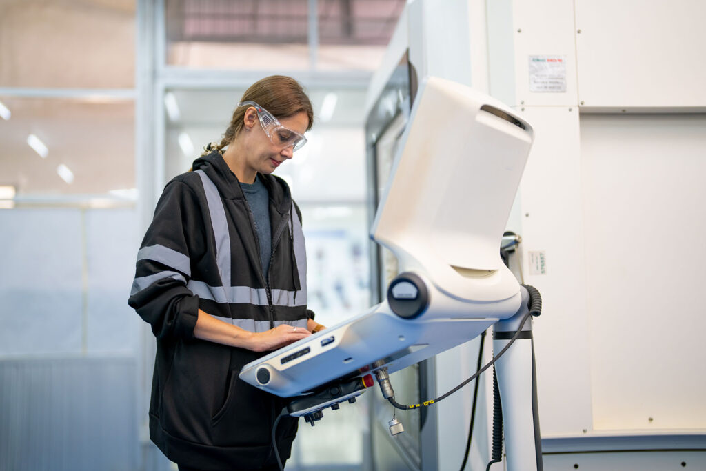 Engineer working with controls for robot